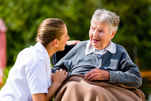 Caregiver providing assistance with activities of daily living