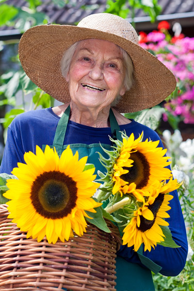 Elderly woman enjoying gardening activities